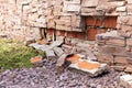 Fallen off decorative bricks from the wall.ÃÂ¡lose up.Soft focus.ÃÂ¡oncept of weather damage, improper installation of construction